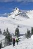 Hikers on a snow-covered mountain - Hikers on a hill