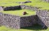 Sunbathing llama on Machu Picchu's terrace - Relaxing llama