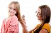 Elder sister is combing little sister's hair - Sisters