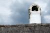 White old chimney on top of a thatched cottage - Old chimney