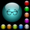 Eyeglasses icons in color illuminated spherical glass buttons on black background. Can be used to black or dark templates - Eyeglasses icons in color illuminated glass buttons