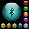 Bluetooth icons in color illuminated spherical glass buttons on black background. Can be used to black or dark templates - Bluetooth icons in color illuminated glass buttons