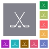 Hockey sticks with puck flat icons on simple color square backgrounds - Hockey sticks with puck square flat icons