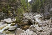 A small rapid river among big rocky mountains - Rocky river