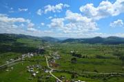 View of a nice town in a valley with a mountain ridge in the background - Settlement with nice surroundings