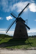 windmill in the landscape with blue sky - old windmill