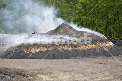 Charcoal pile - Making of charcoal with burning