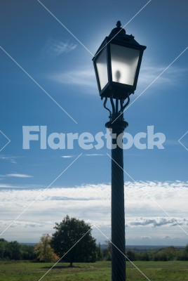 street lamp - street lamp in the landscape, illuminated by the sun