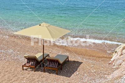 They are waiting for you - Two luxury sunbeds with parasol